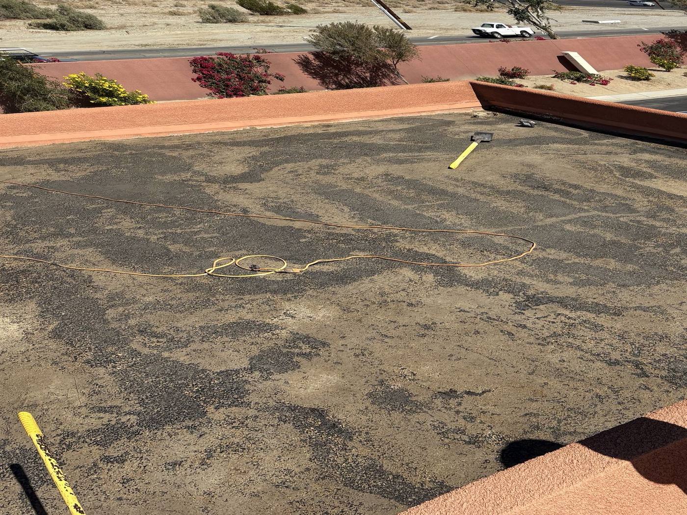 Before: Flat roof with parapet walls