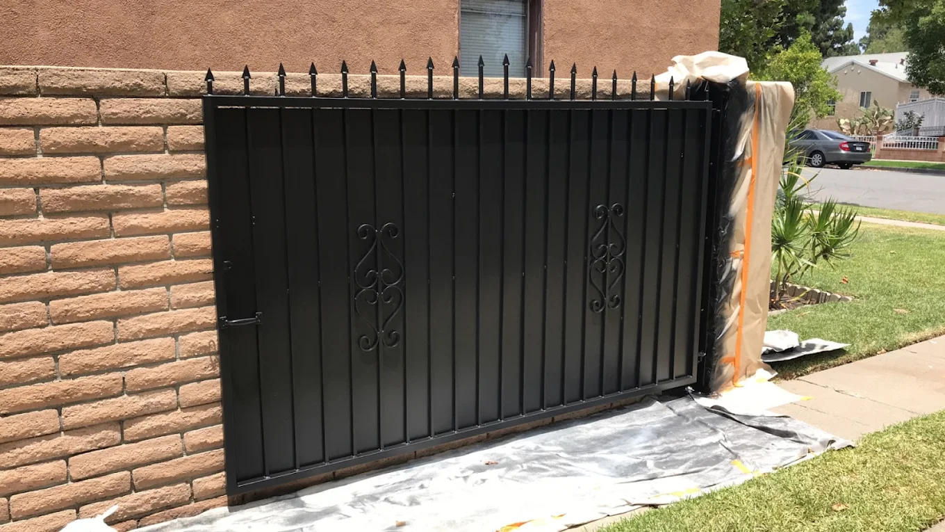 Backyard wood gate painted dark forest green