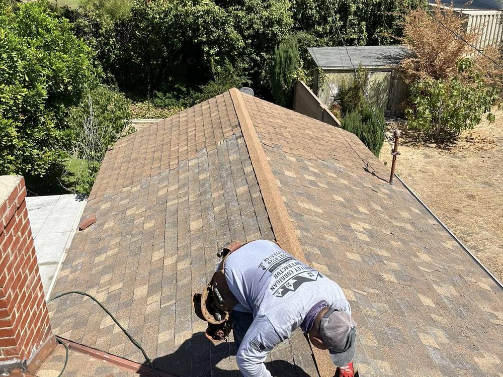Roofer working on a residential roof repair