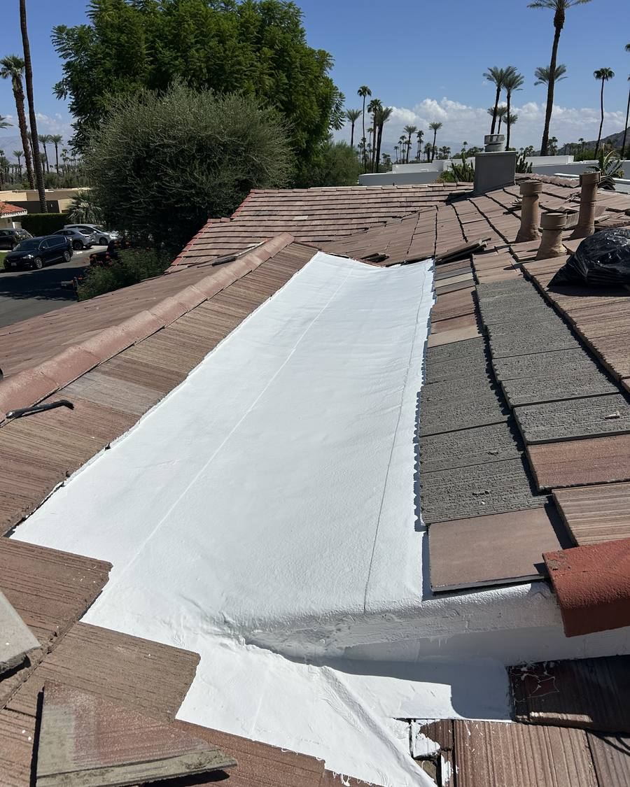 White membrane run through a tile roof valley